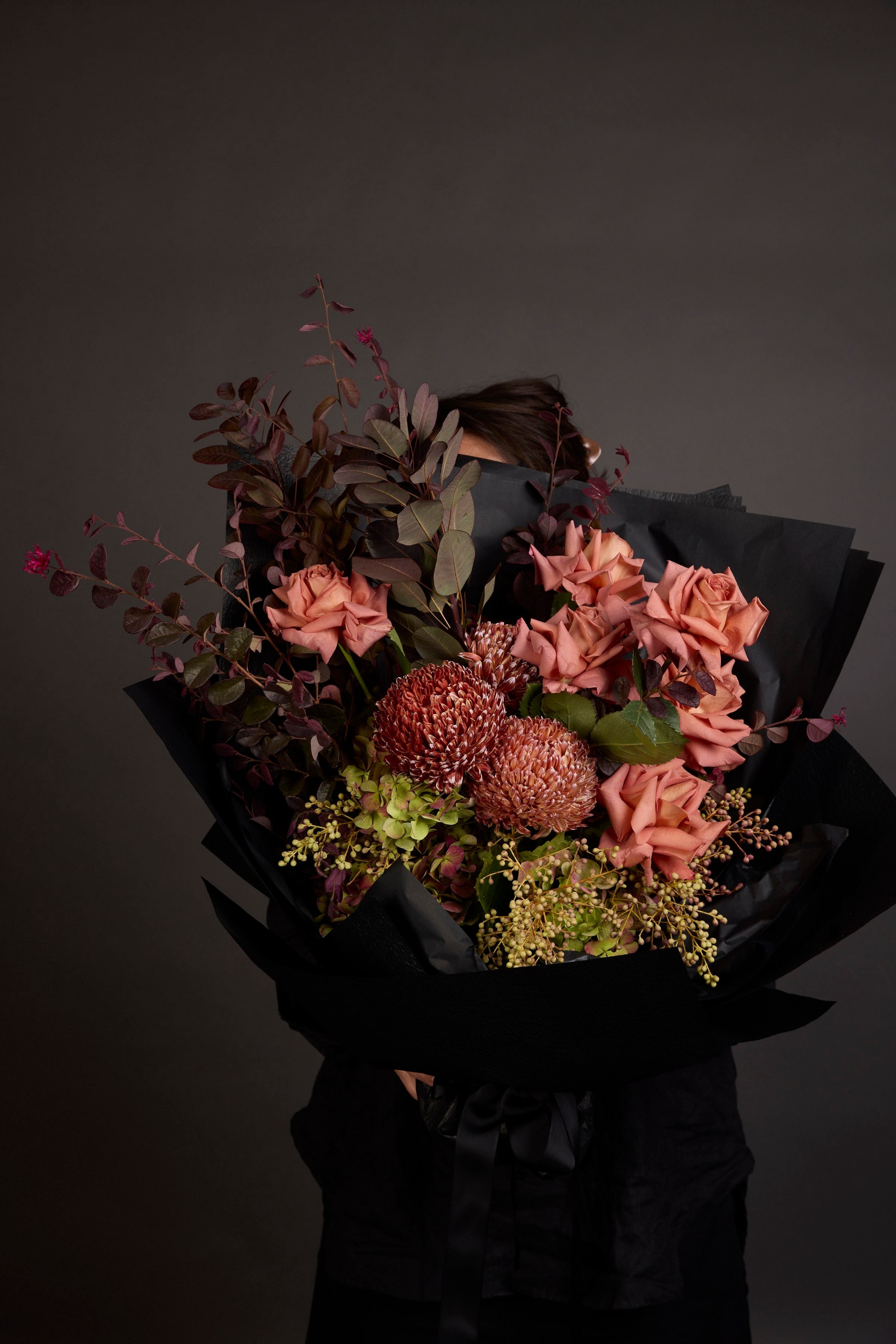 Romantic anniversary flower bouquet by Victoria Whitelaw with roses and seasonal blooms, elegantly wrapped for delivery in Melbourne