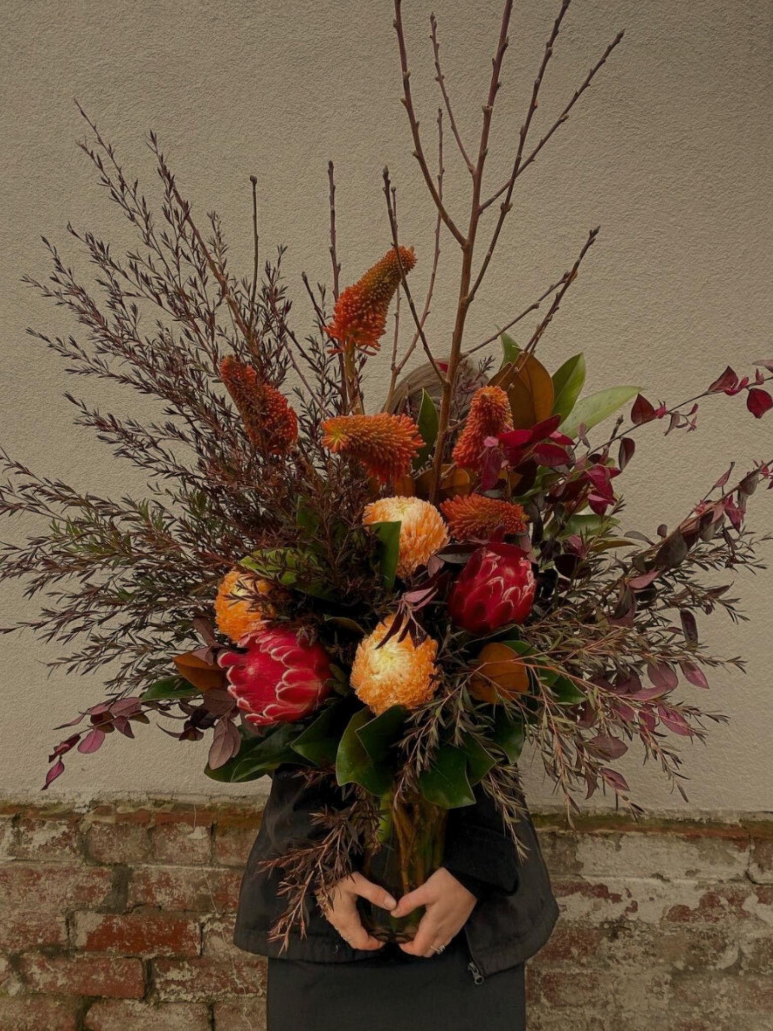 Luxury winter flower bouquet featuring seasonal blooms like hellebores and tulips, handcrafted in Melbourne.