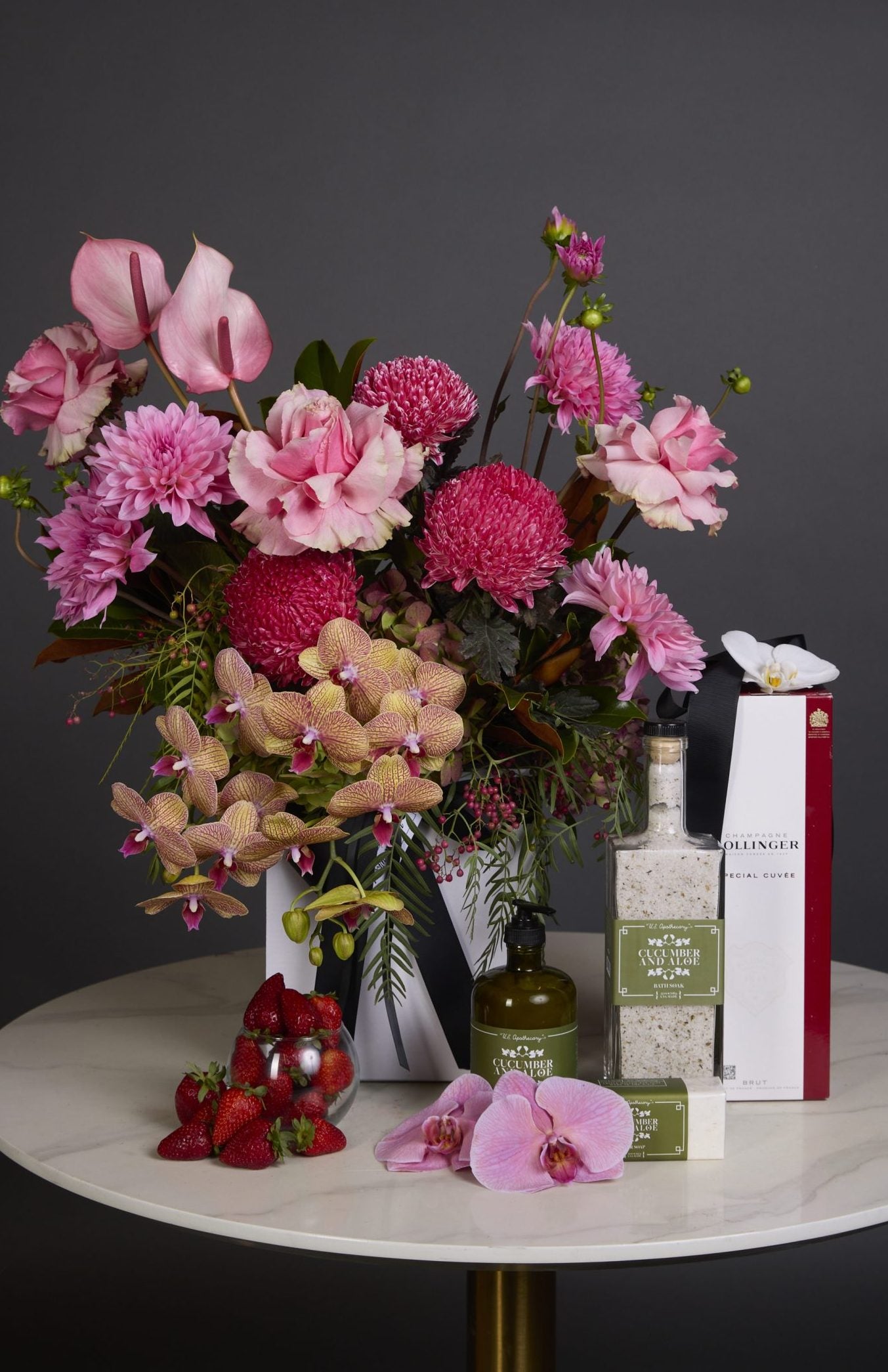 Endless Love gift set with pink seasonal flowers, champagne, and botanical self-care
