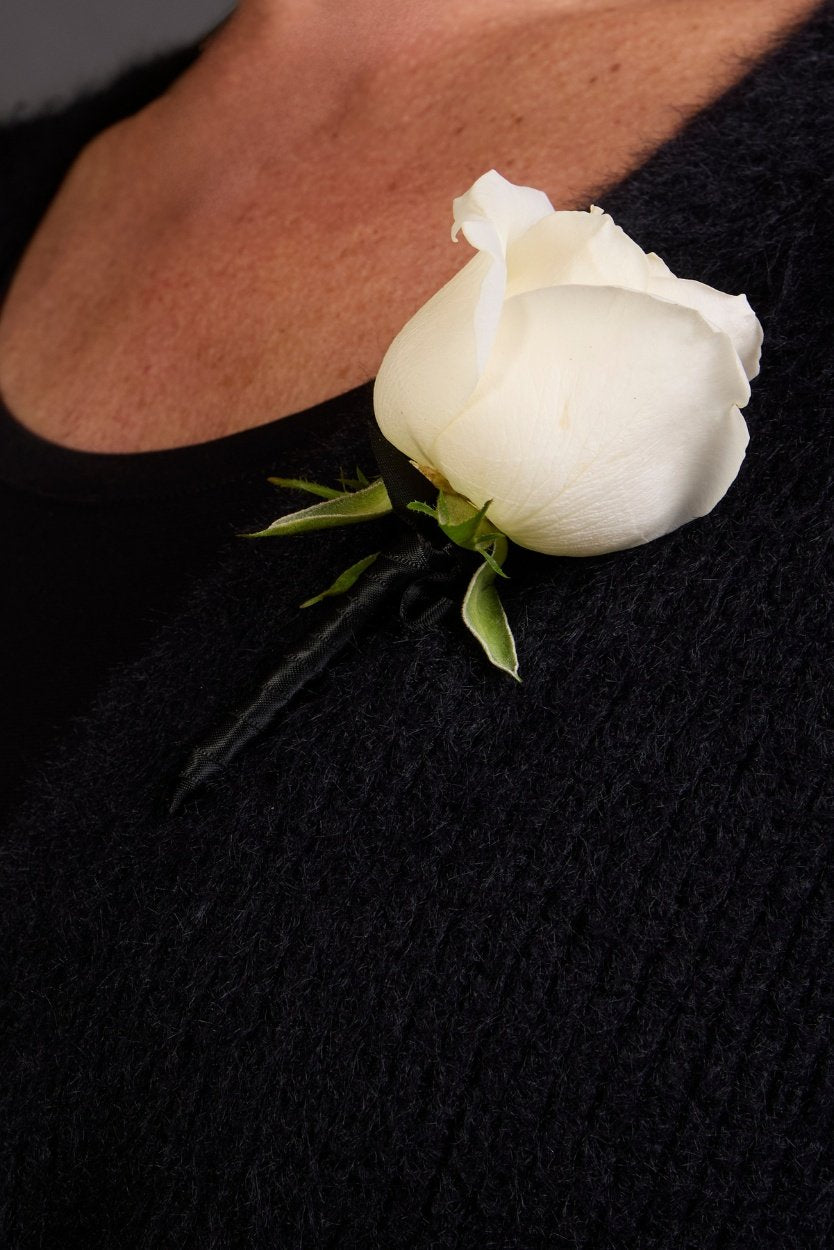 buttonhole pinned on person for formal event in melbourne