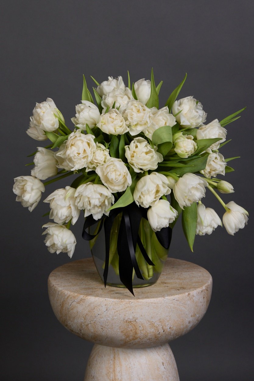 a bouquet of white tulips with different kinds of tulips