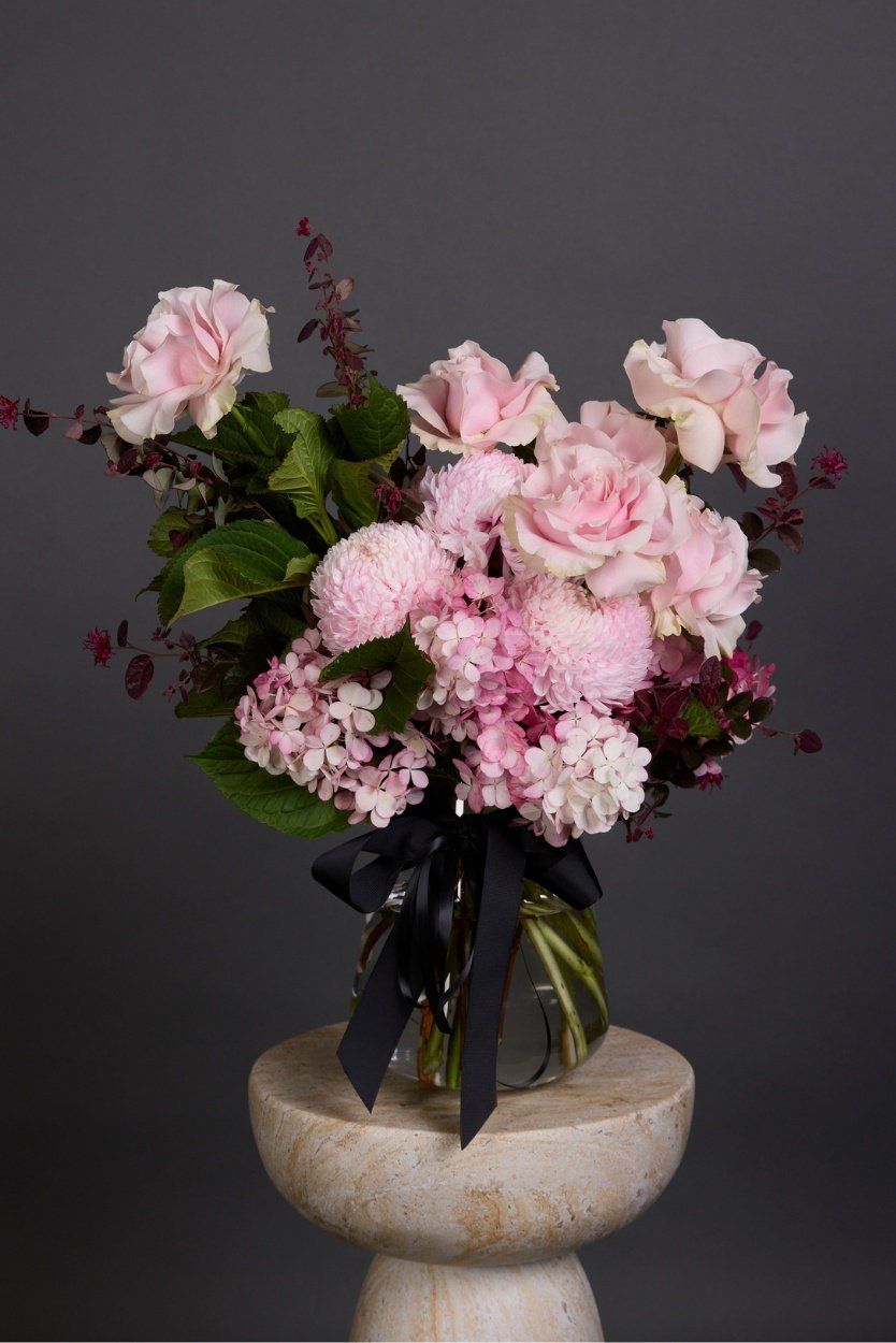 Fraise bouquet featuring powder pink and deep berry-hued seasonal flowers