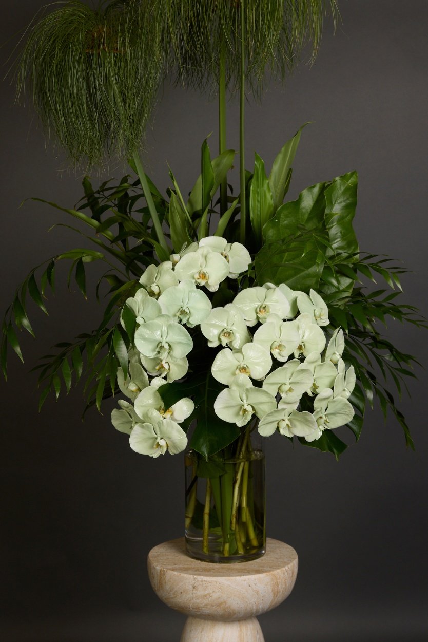 Green Goddess arrangement featuring luxurious green orchids and dramatic foliage