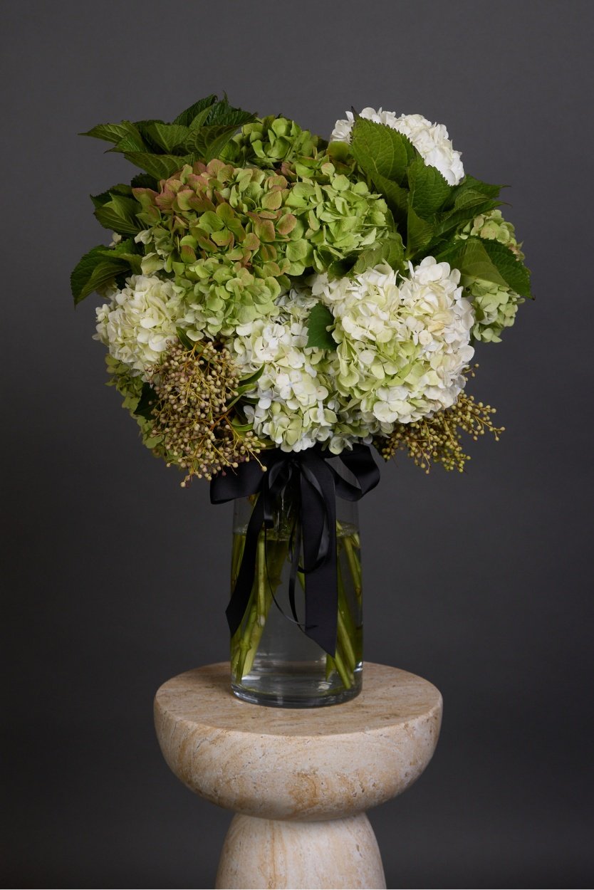 Hydi bouquet of fluffy white and pastel hydrangeas with rich green foliages – Victoria Whitelaw