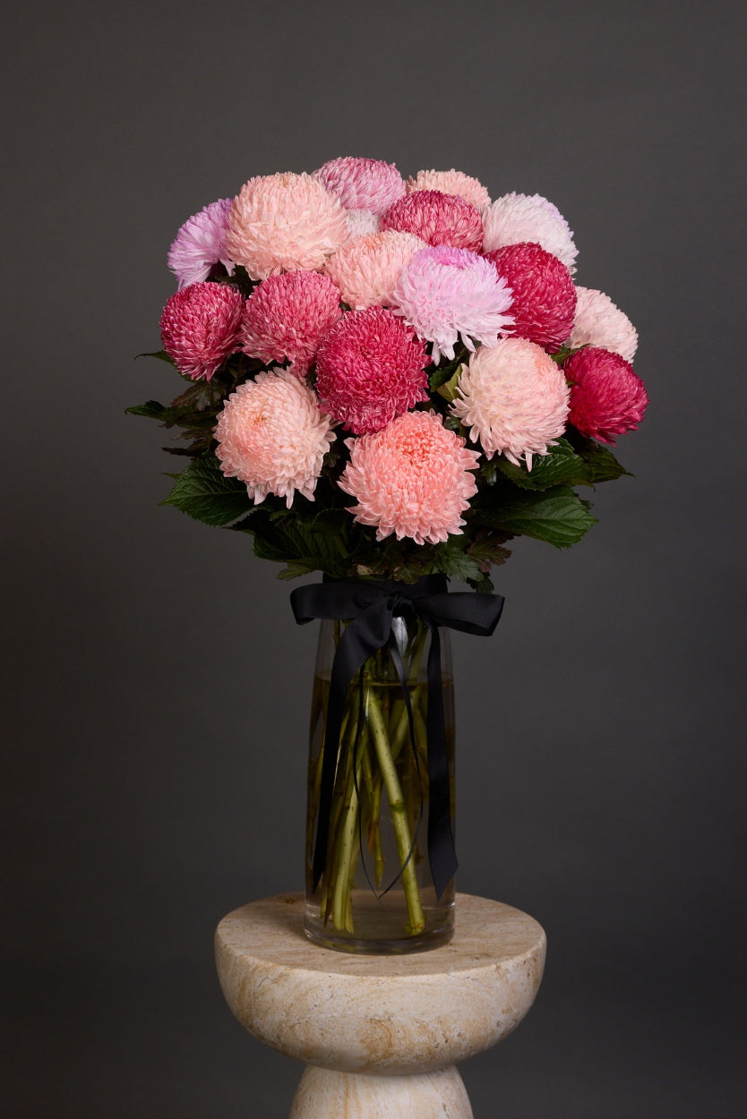 Stunning chrysanthemum disbuds presented en masse with luscious seasonal foliages