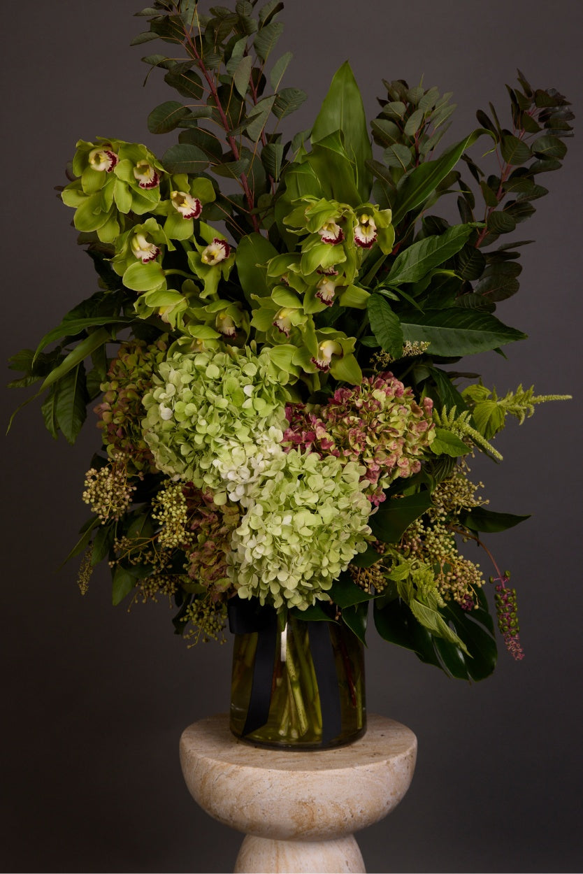 Unique and full of texture, this spectacular arrangement showcases the season’s most intriguing garden-inspired floral and foliage varieties in lush shades of green