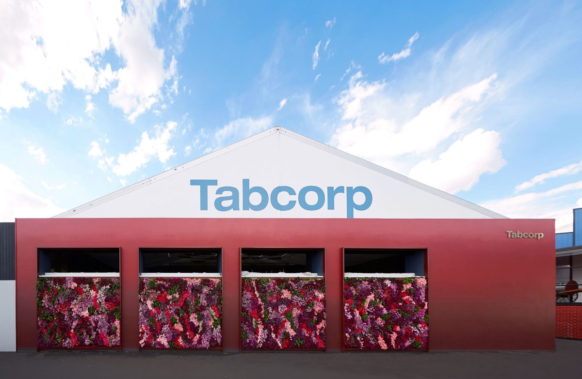 Tabcorp branded building with floral facade against a blue sky
