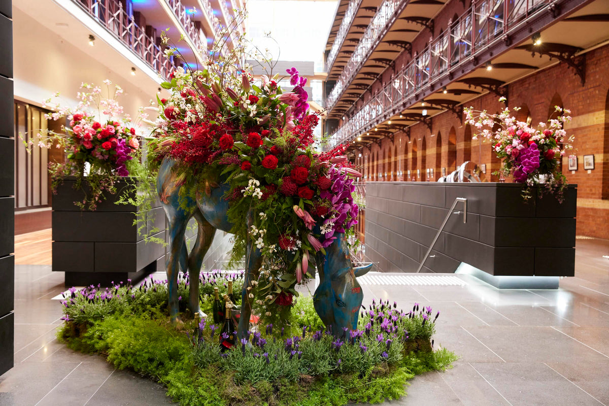 Decorative horse racing with floral arrangements in a hotel melbourne cbd