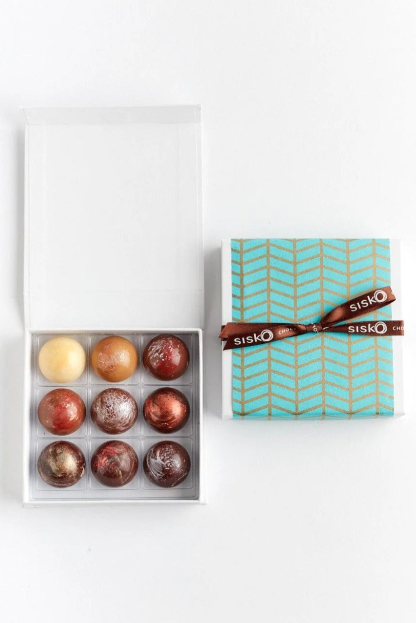 Box of chocolates with a Sisko branded box on a white background