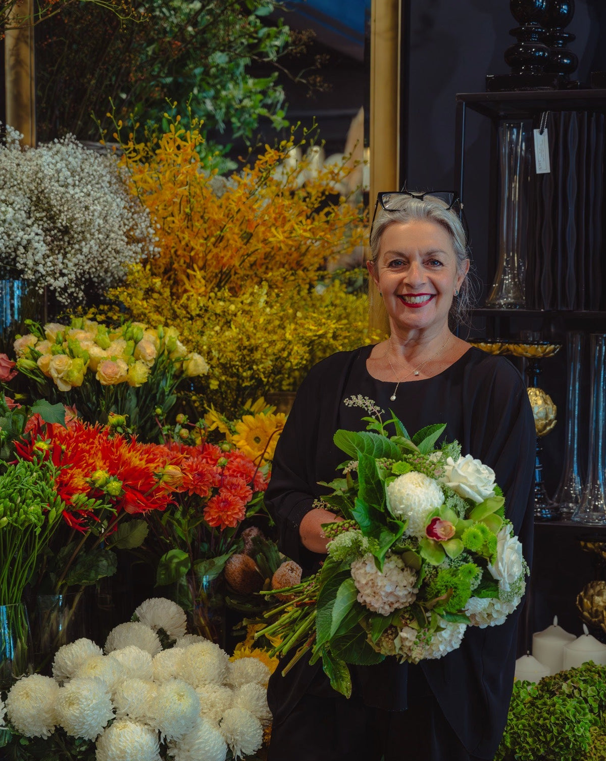 Victoria Whitelaw holding a bouquet of flowers in a South Yarra floral shop