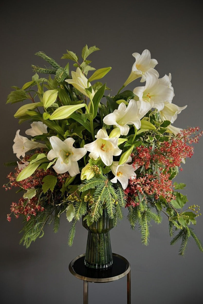 fragrant Christmas lilies with lush festive foliage